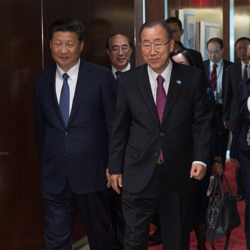 Chinese President Xi Jinping left walks with United Nations Secretary General Ban Ki-moon on Saturday at U.N. headquarters in New York. At a U.N. conference Xi pledged billions in Chinese aid to developing nations