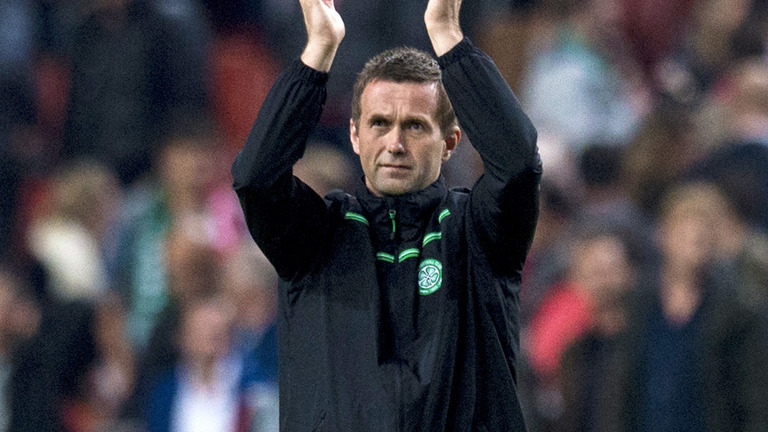 Celtic manager Ronny Deila applauds the fans at full-time