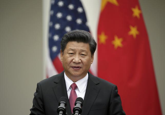 Chinese President Xi Jinping addresses a joint news conference with U.S. President Barack Obama in the Rose Garden at the White House in Washingt