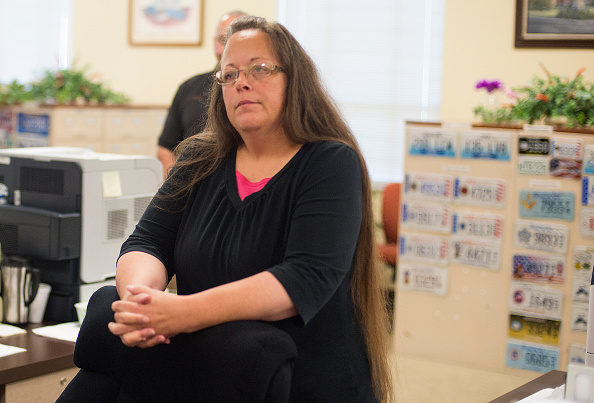 Kim Davis the Rowan County Clerk of Courts listens to Robbie Blankenship and Jesse Cruz as they speak with her at the County Clerks Office