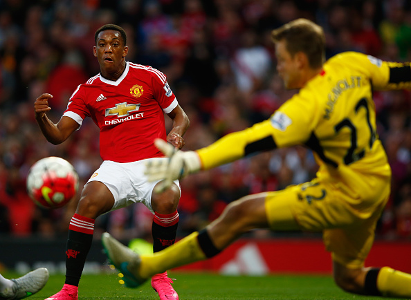 MANCHESTER ENGLAND- SEPTEMBER 12 Anthony Martial of Manchester United scores past Simon Mignolet of Liverpool for his team's third goal during the Barclays Premier League match between Manchester United and Liverpool at Old Trafford