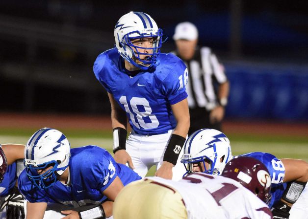 Warren Hills Regional High School quarterback Evan Murray looks over the Summit defense in Washington N.J. Murray a three-sport athlete died after suffering an injury on the field school officials said Saturday Sept. 26