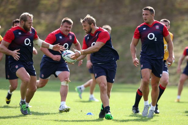 Chris Robshaw offloads the ball to team mate James Haskell during an England training session