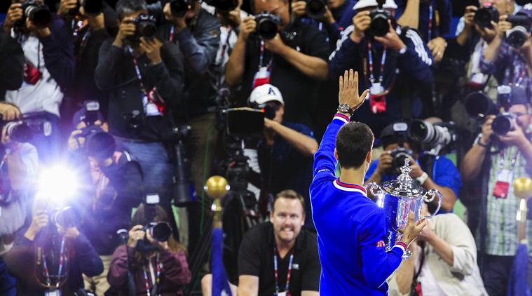 Novak Djokovic of Serbia celebrates after beating Roger Federer of Switzerland in the men's championship match of the U.S. Open tennis tournament. | AP