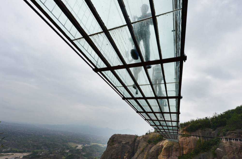 Who fancies a stroll over this GLASS suspension bridge 600 feet above a canyon