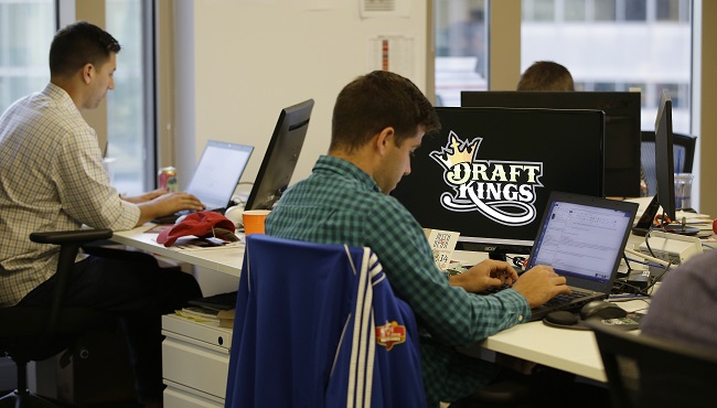 Bear Duker a marketing manager for strategic partnerships at DraftKings a daily fantasy sports company works at his computer in Boston. The daily fantasy sports industry is eyeing a breakout season as NFL games