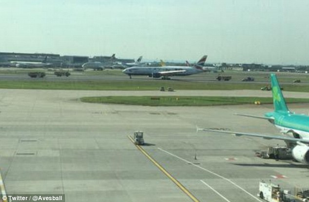 Drama Fire engines rush to the British Airways Boeing 777 at Heathrow this morning after it landed safely from Washington today