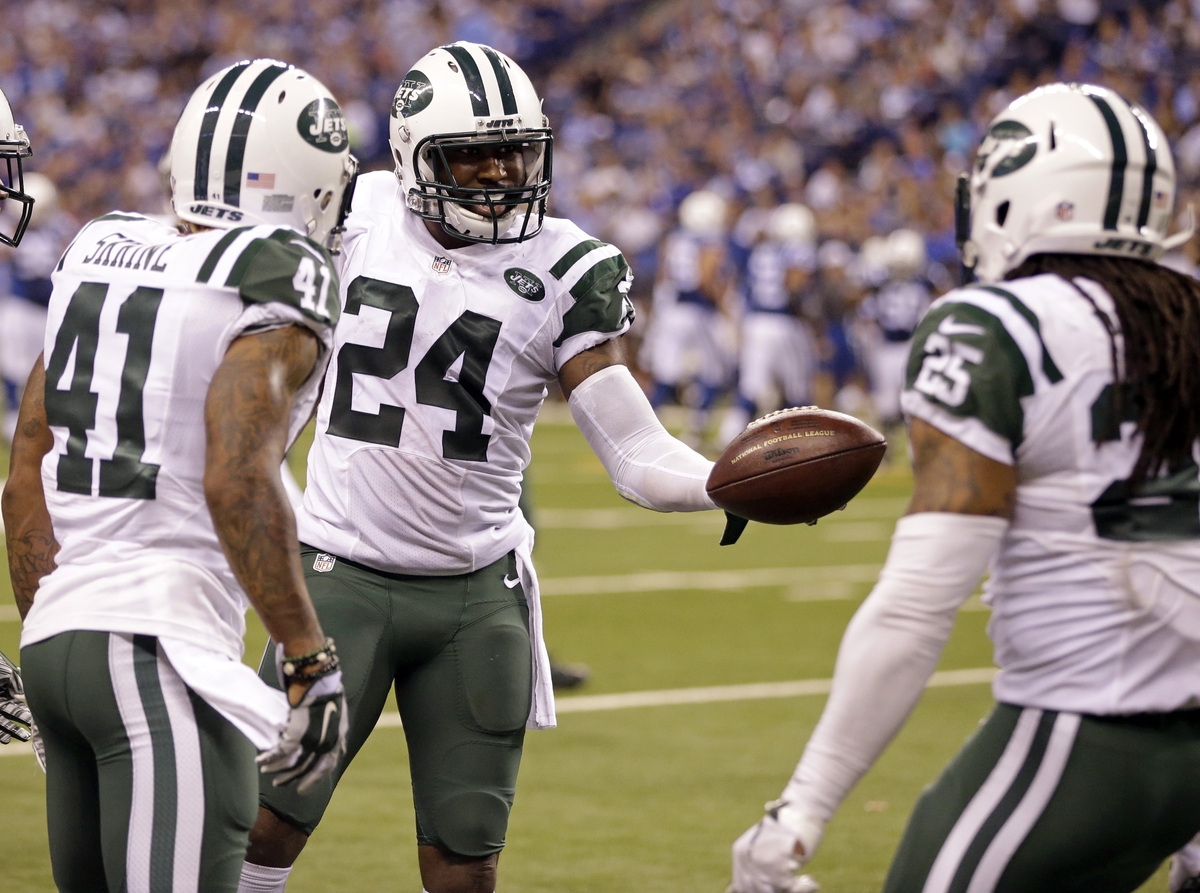 Jets cornerback Darrelle Revis celebrates an interception with Buster Skrine and Calvin Pryor in the second half of Monday night's game against the Colts at Indianapolis