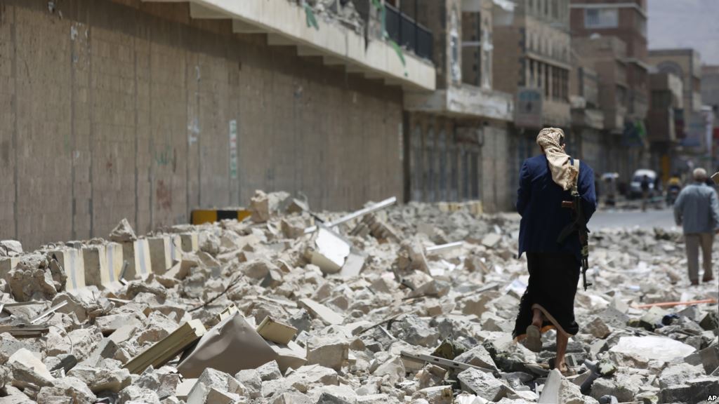 FILE- A Houthi rebel is seen walking amid the rubble left by Saudi-led airstrikes in Sana'a Yemen Sept. 16 2015