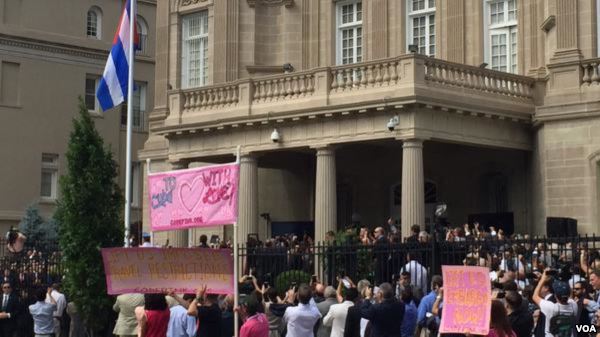 FILE- The Cuban flag goes up for the first time in 54 years at the embassy in Washington