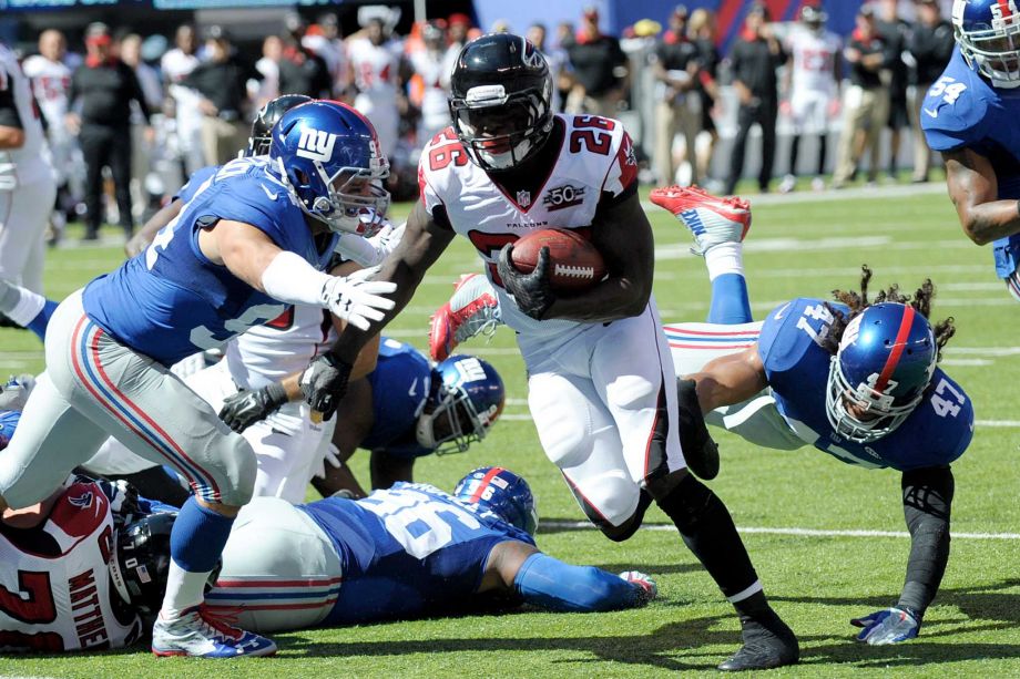 Atlanta Falcons running back Tevin Coleman scores a touchdown against the New York Giants during the first half of an NFL football game Sunday Sept. 20 2015 in East Rutherford N.J