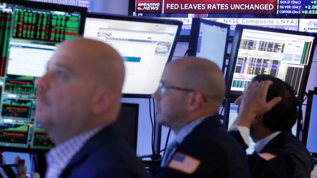 Stocks fell in North America Friday as investors wrestled with the pronouncement from the U.S. Federal Reserve that it was keeping U.S. interest rates where they are for now in large part because it's worried about the strength of the global economy