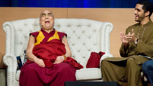 The Dalai Lama laughs during his three-day Global Compassion Summit at the University of California Irvine in July when he celebrated his 80th birthday