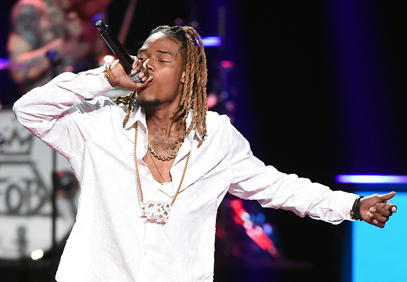 LAS VEGAS NV- SEPTEMBER 19 Rapper Fetty Wap performs with Fall Out Boy at the 2015 iHeartRadio Music Festival at MGM Grand Garden Arena