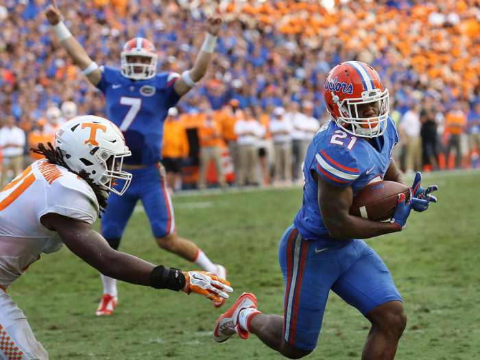 Florida quarterback Will Grier celebrates in the background as running back Kelvin Taylor scores a touchdown against Tennessee at Ben Hill Griffin Stadium in Gainesville Fla. on Saturday Sept. 26 2015. The host Gators won 28-27. TNS