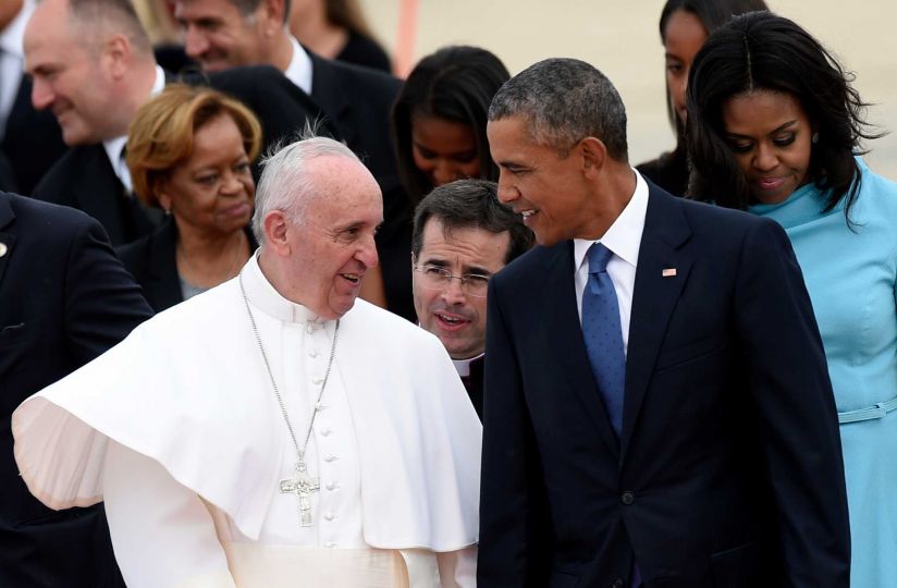 Pope Francis talks with President Obama after arriving at Andrews Air Force Base in Maryland on Tues