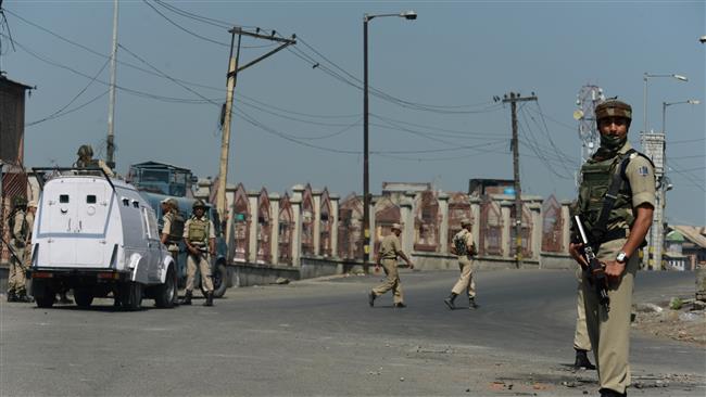 Indian paramilitary troopers stand guard during a one-day strike in downtown Srinagar