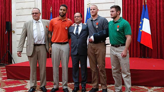 From the left British businessman Chris Norman Anthony Sadler French President Francois Hollande U.S. Airman Spencer Stone and Alek Skarlatos a U.S. National Guardsman from Roseburg Oregon pose at the Elysee Palace Monday Aug.24 2015 in Paris