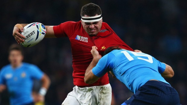 French charge Guilhem Guirado of France tries to break away from the tackle of Luke Mc Lean of Italy