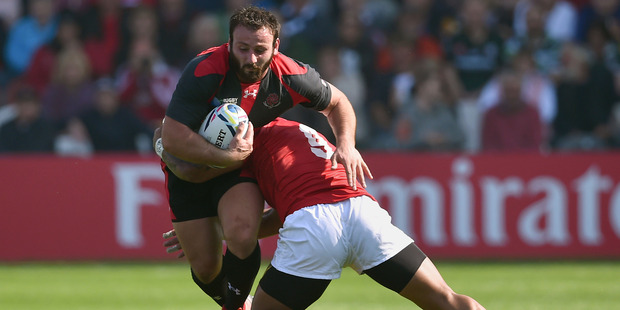 Georgia's Giorgi Tkhilaisvili runs the ball during his side's 17-10 victory over Tonga to open their Rugby World Cup campaign