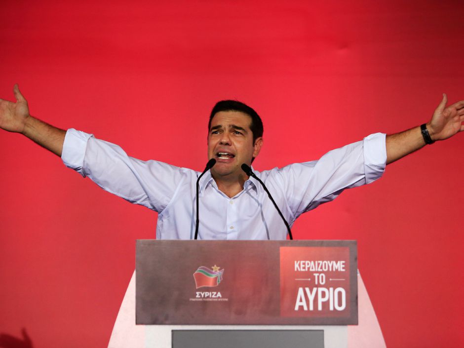 Syriza left-wing party leader and former Prime Minister Alexis Tsipras gestures as he delivers a pre-election speech to his supporters at Syntagma square in central Athens Friday Sept. 18 2015