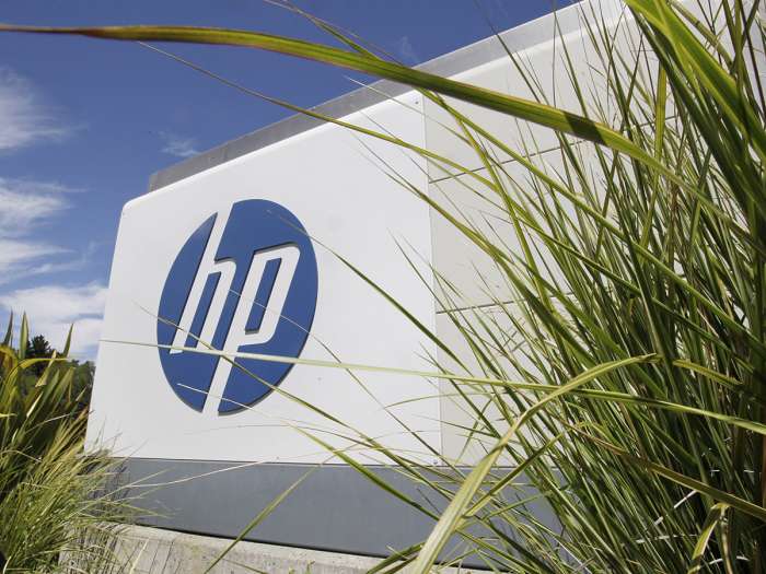 Hewlett-Packard says its upcoming spinoff of its technology divisions focused on software consulting and data analysis will eliminate up to 30,000 jobs. Associated Press