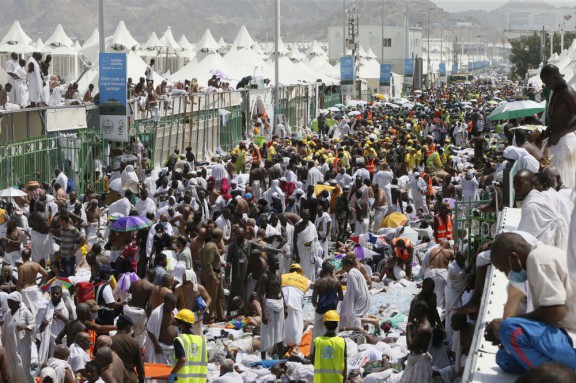 Muslim pilgrims and rescuers gather around people who were crushed by overcrowding in Mina Saudi Arabia during the annual hajj pilgrimage