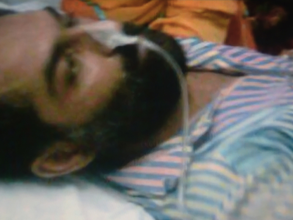 Pakistani prisoner and convicted murdered Abdul Basit lies on a hospital bed in Faisalabad in this