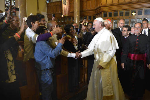 Pope Francis greets parishioners immigrants and clients of Catholic Charities as he arrives at St. Patrick's Church in Washington Sept. 24 2015