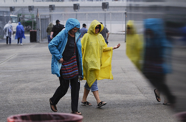 A fan leaves during a rain delay at Chicagoland Speedway on Friday Sept. 19 2015. NASCAR set the field for the Sprint Cup Series&#039 Chase opener based on speeds from the only practice session of the day