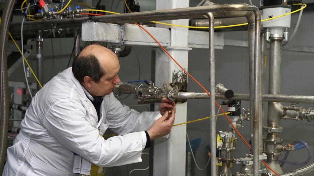 An International Atomic Energy Agency inspector cuts a uranium enrichment connection at Iran's Natanz facility 200 miles south of Tehran in 2014. The U.S. Congress is expected to address the Iranian nuclear deal this month. One unanswered question