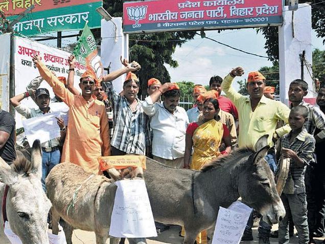 BJP ticket aspirants who were denied nominations protest outside the party office in Patna on Thursday