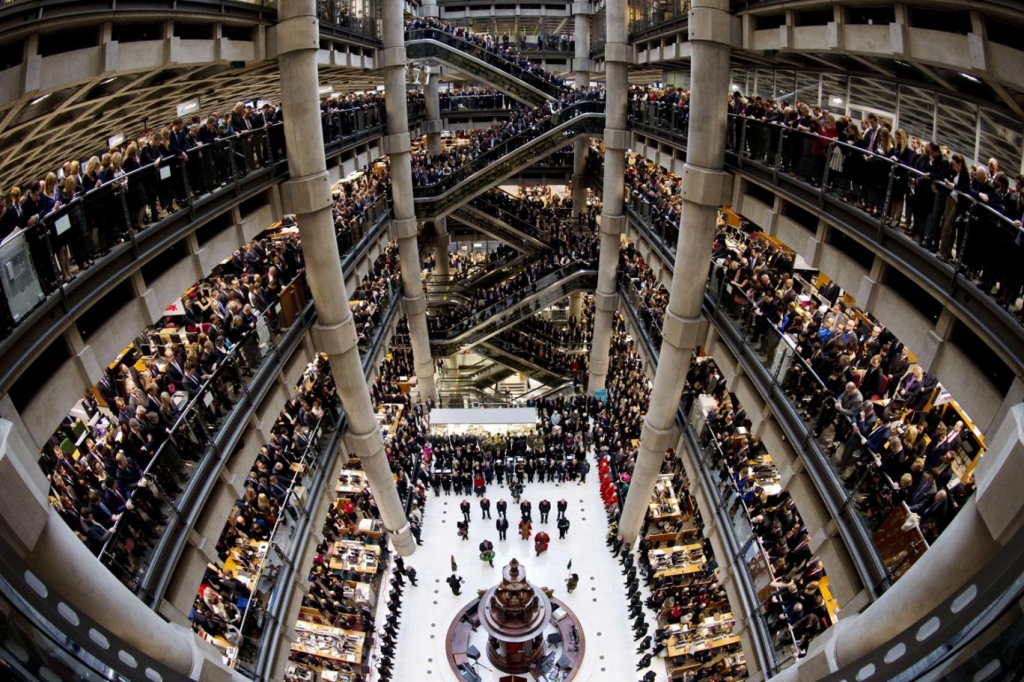 Brokers and underwriters line the balconies and escalators of the Lloyd's of London