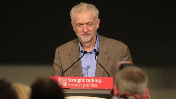 Labour leader Jeremy Corbyn receives applause by delegates before making a speech at the Hilton Brighton Metropole during the annual Labour Party conference