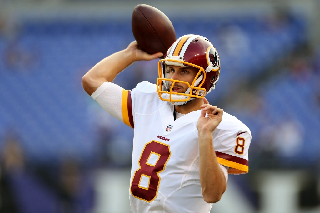 BALTIMORE MD- AUGUST 29 Quarterback Kirk Cousins #8 of the Washington Redskins warms up prior to the start of a preseason game against the Baltimore Ravens at M&T Bank Stadium