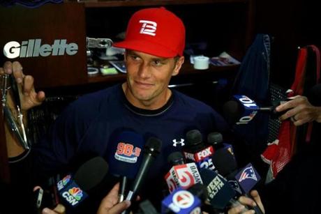 Foxboro Ma 09/23/2015 New England Patriots QB Tom Brady talks with the media at his locker before the teams practice.. Staff