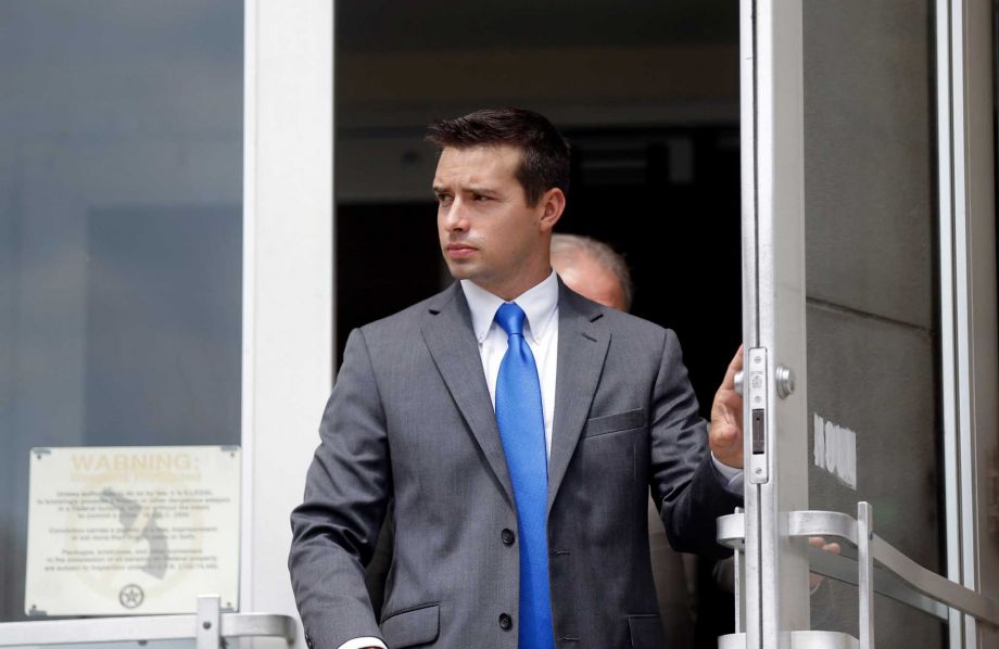 Former Madison Ala. police officer Eric Sloan Parker walks out of the federal courthouse Wednesday Sept. 9 2015 in Huntsville Ala. Parker accused of using excessive force against an Indian grandfather who testified he didn't understand commands