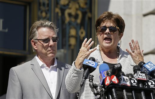 Liz Sullivan right and Jim Steinle left the parents of Kathryn Steinle answer questions during a news conference on the steps of City Hall Tuesday Sept. 1 2015 in San Francisco. The parents of the San Francisco woman shot to death by a man being