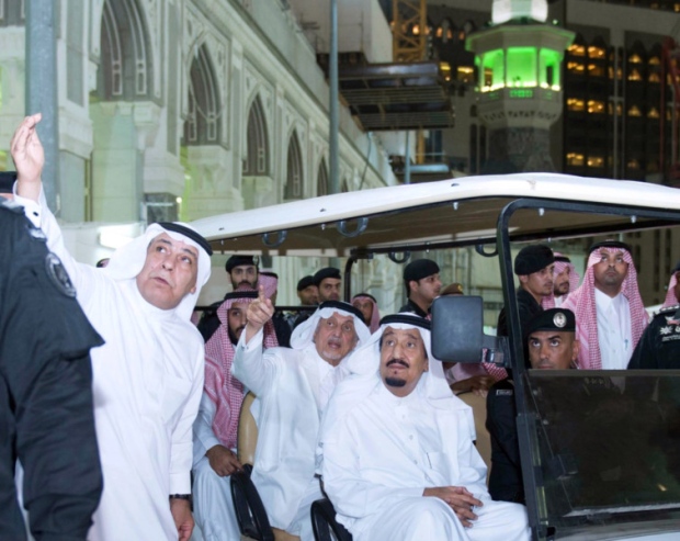 King Salman bin Abdulaziz centre tours the site of the accident inside the Grand Mosque at Mecca