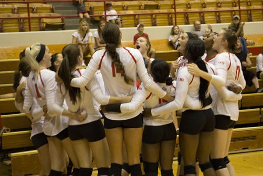 Members of the OSU women's volleyball team huddle before a game against Minnesota on Sept. 23 at St. John Arena. OSU lost 3-2. Credit Sarah Mikati  Lantern