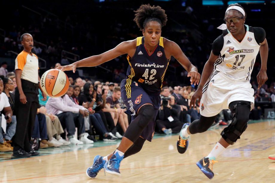 Indiana Fever guard Shenise Johnson drives to the basket past New York Liberty forward Essence Carson during the first half of Game 1 of the WNBA basketball Eastern Conference finals Wednesday Sept. 23 2015 at Madison Square Garden in New Yor