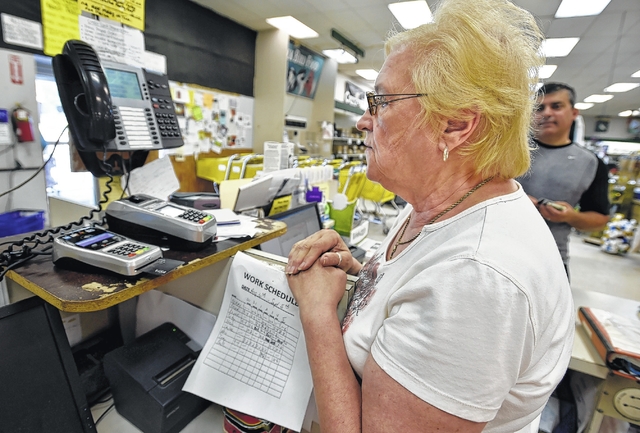 Renee Cragle processes Shavertown resident Charles Leo’s EMV card at the Agway in Dallas