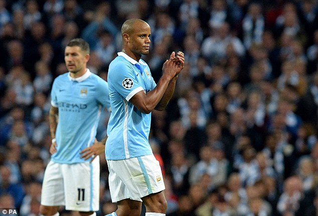 Manchester City captain Vincent Kompany applauds the fans after being forced off with a calf injury