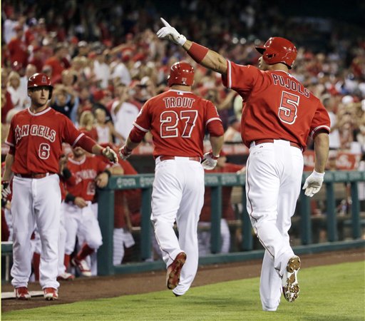 Los Angeles Angels&#039 Albert Pujols right celebrates his two run home run against the Seattle Mariners during the first inning of a baseball game in Anaheim Calif. Friday Sept. 25 2015