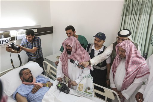 Abdul Rahman Al Sudais Imam of the Grand Mosque in Mecca visits one of the victims of the crane accident at the mosque at Al Nour specialist hospital in Mecca Saudi Arabia Sunday Sept. 13 2015. High winds were to blame for the toppling of a massive