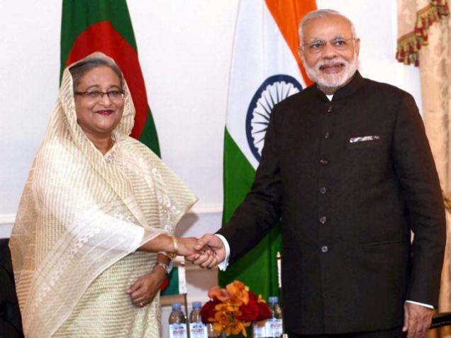 Prime Minister Narendra Modi shakes hands with his Bangladeshi counterpart Sheikh Hasina