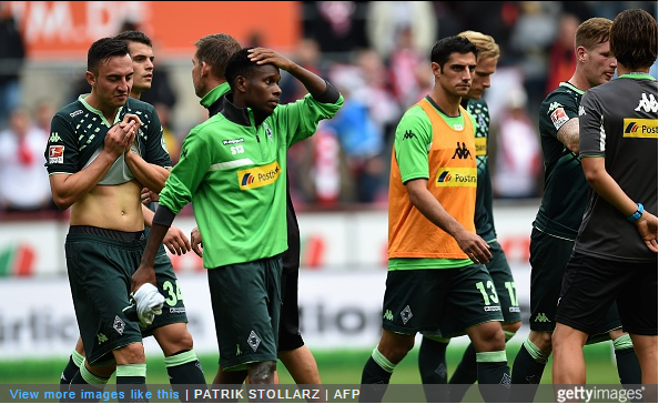 Moenchengladbach's players react after their Bundesliga match against FC Cologne