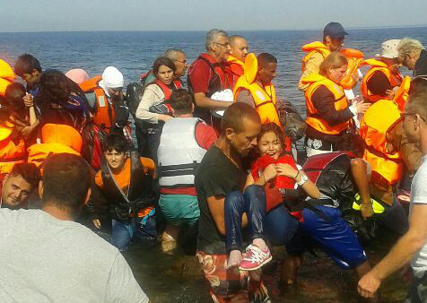 Spalding man of refugees arriving in Greece