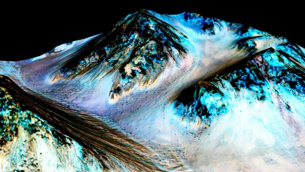 Dark narrow 100 metre-long streaks on Mars believed to have been formed by flowing water are seen in an image produced by NASA