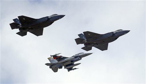 An F-16 below escorts two F-35 jets above after arriving at it new operational base Wednesday Sept. 2 2015 at Hill Air Force Base in northern Utah. Two F-35 jets touched down Wednesday afternoon at the base about 20 miles north of Sa